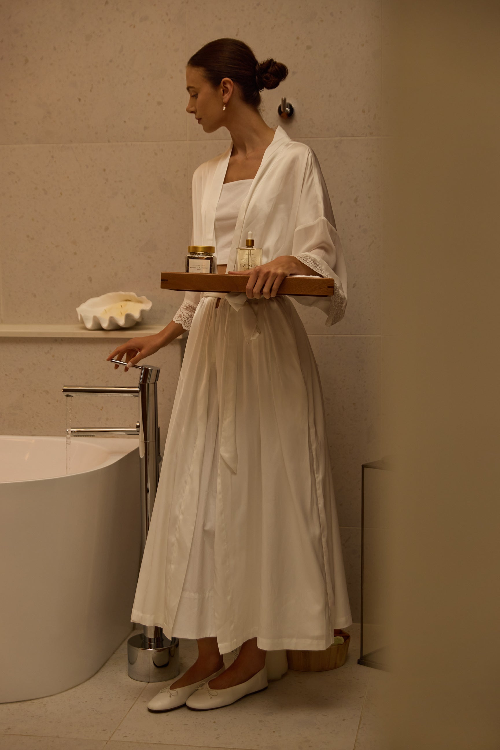 A tray of body care carried to the bath
